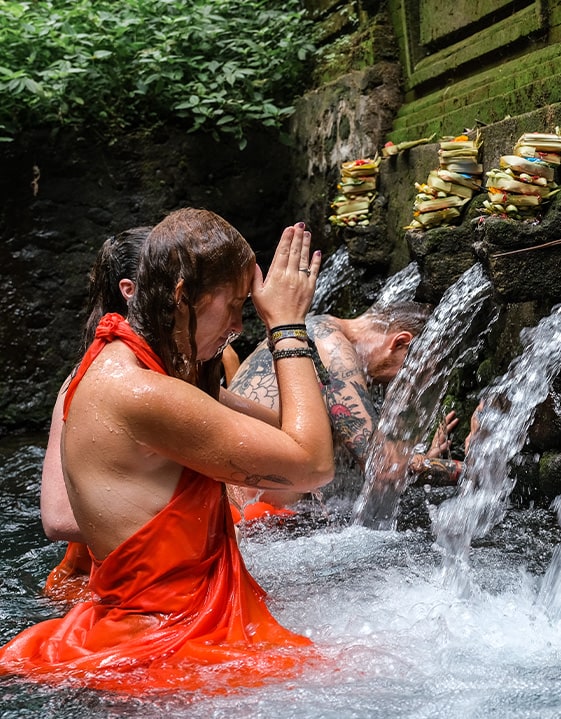 Receive a blessing at a local water temple