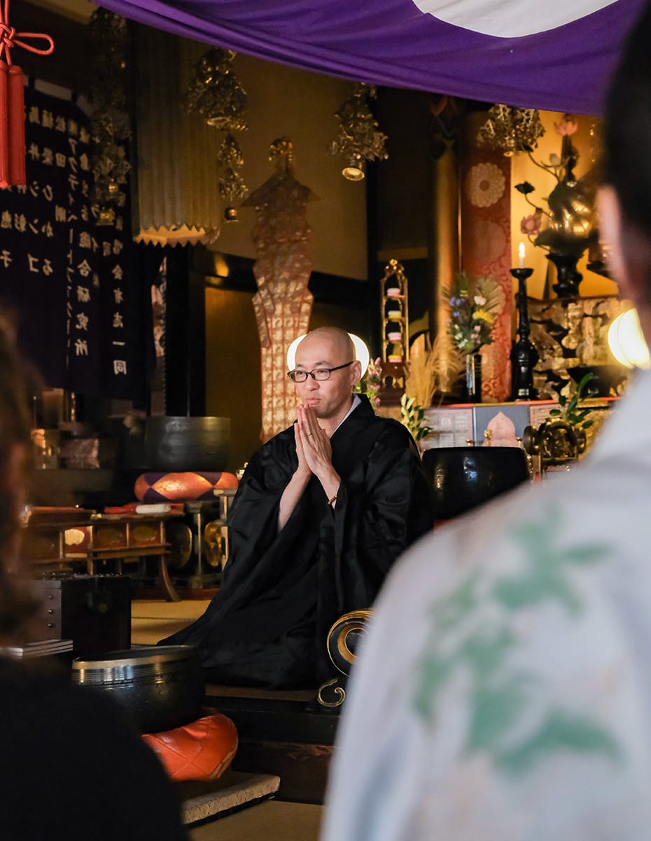 Practice Zen meditation at a temple led by a Buddhist monk
